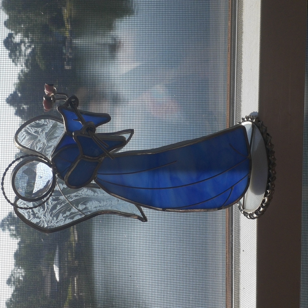 Free standing blue stainglass angel with porcelain roses.